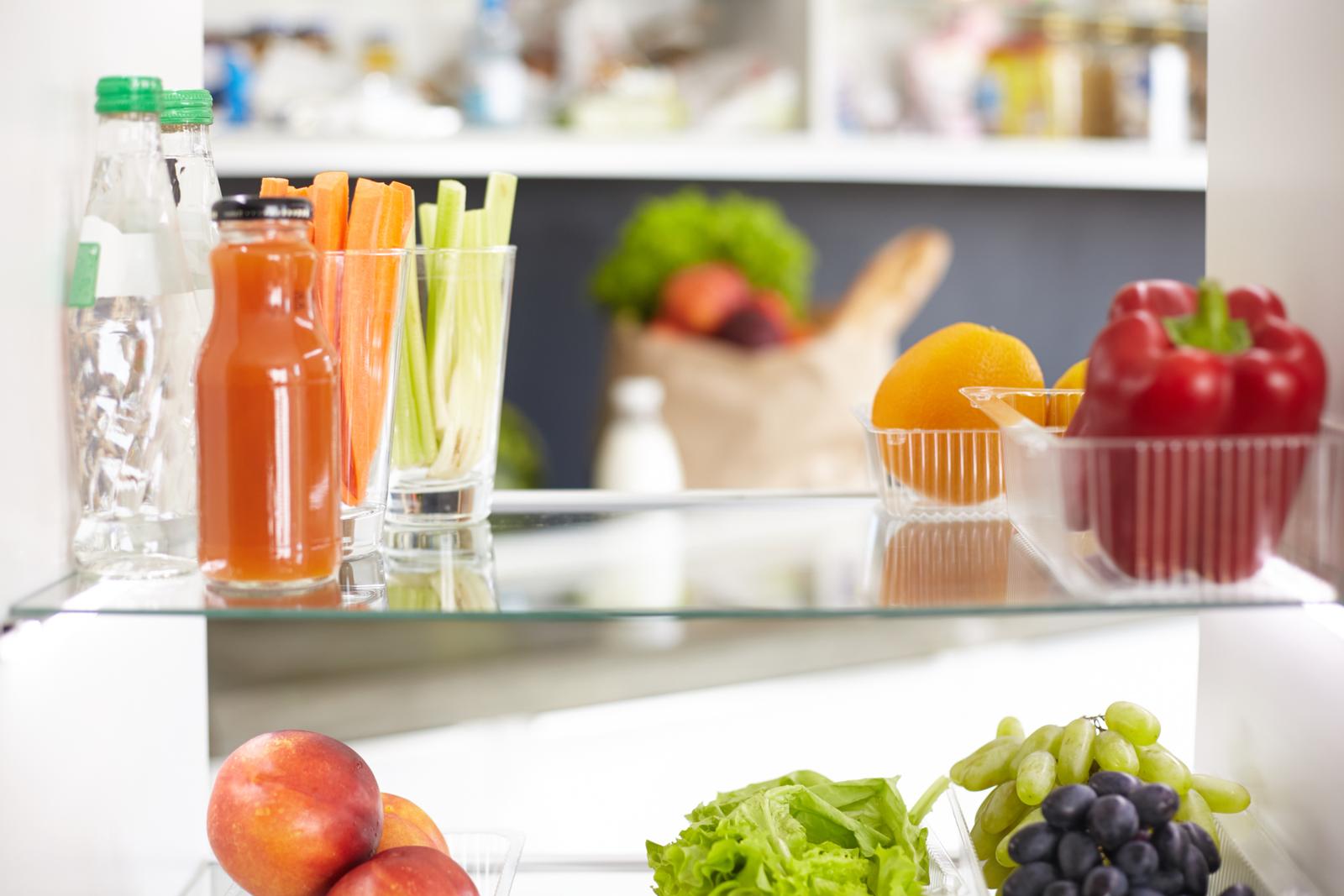 Open refrigerator with fresh fruits and vegetable. Open refrigerator